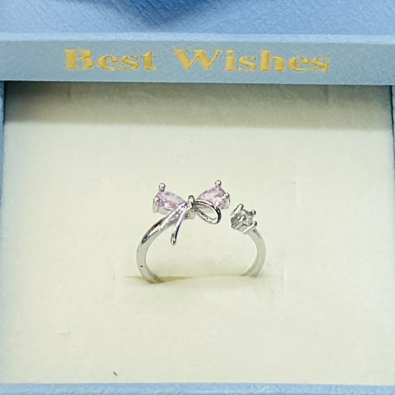 silver mini bow tie adjustable ring for women.