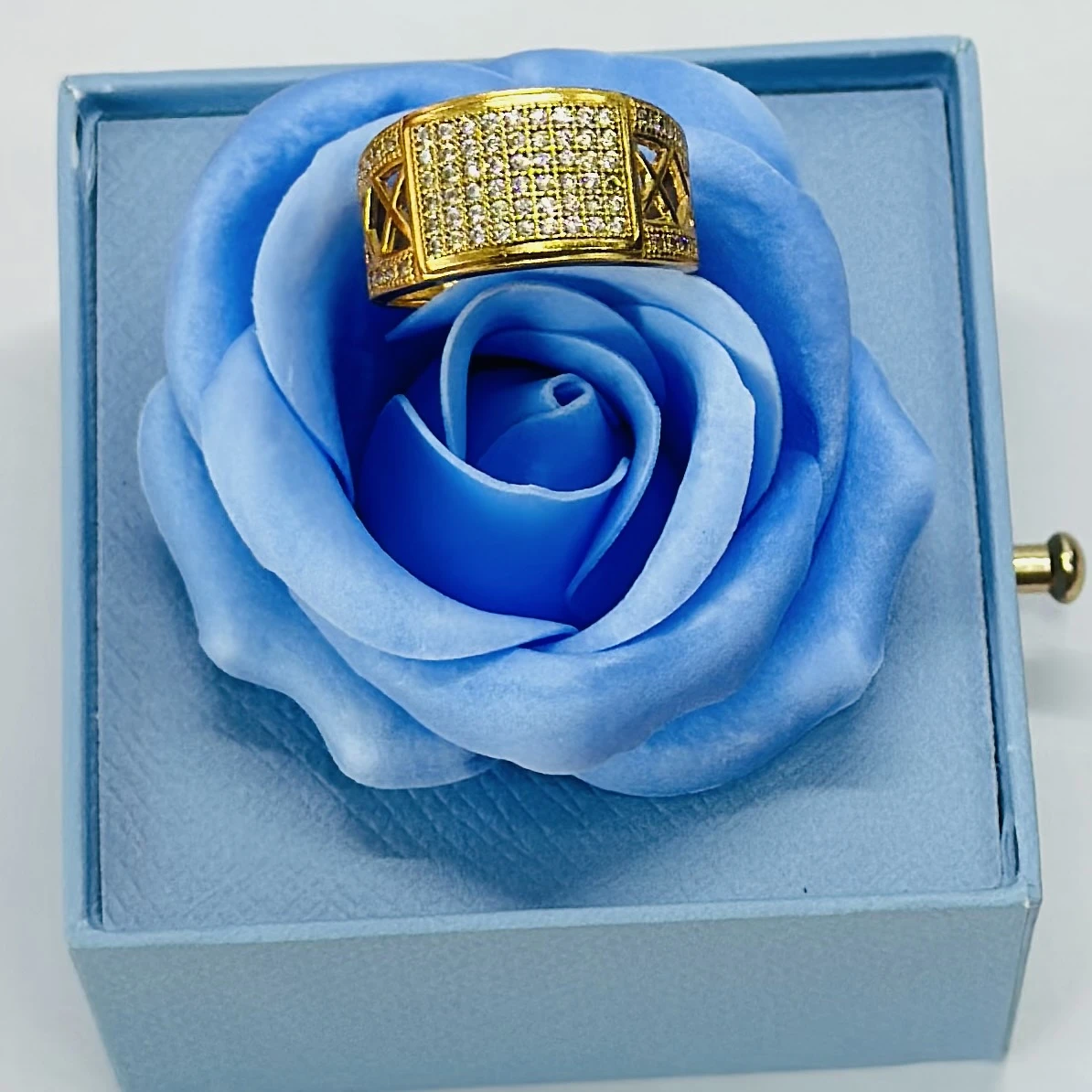 gold-toned men's ring featuring a rectangular face with multiple inset diamonds.