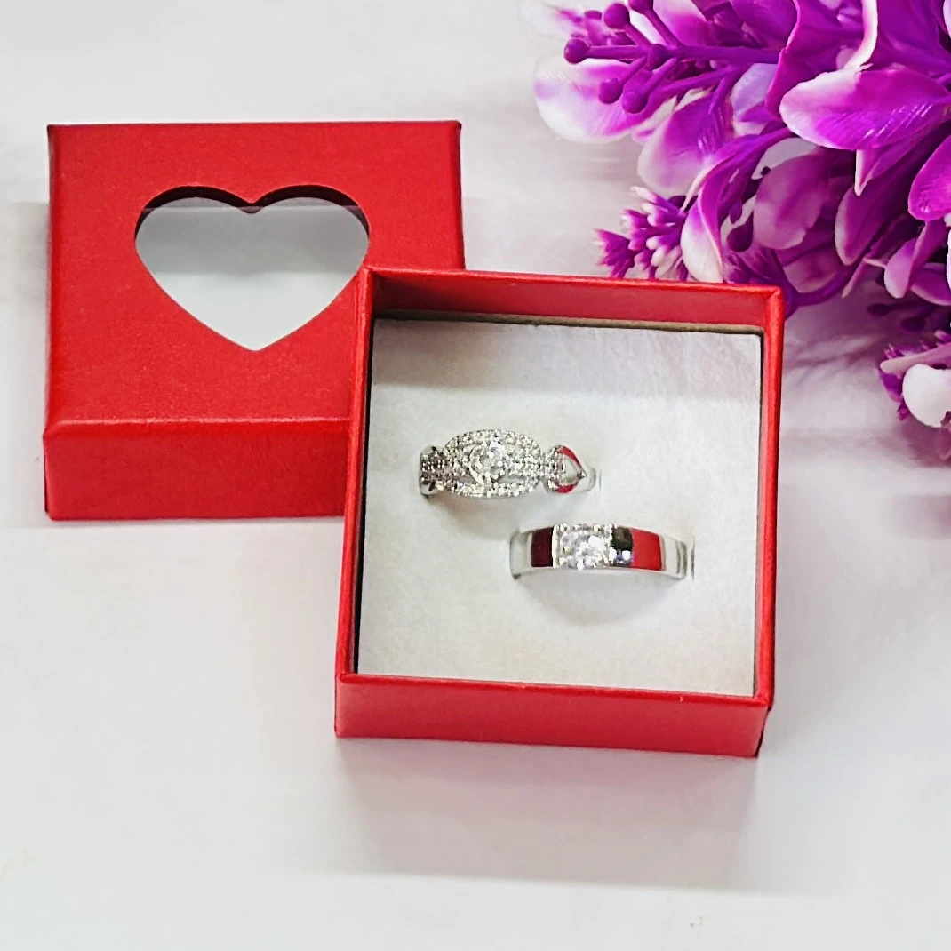 Set of silver-toned couple rings