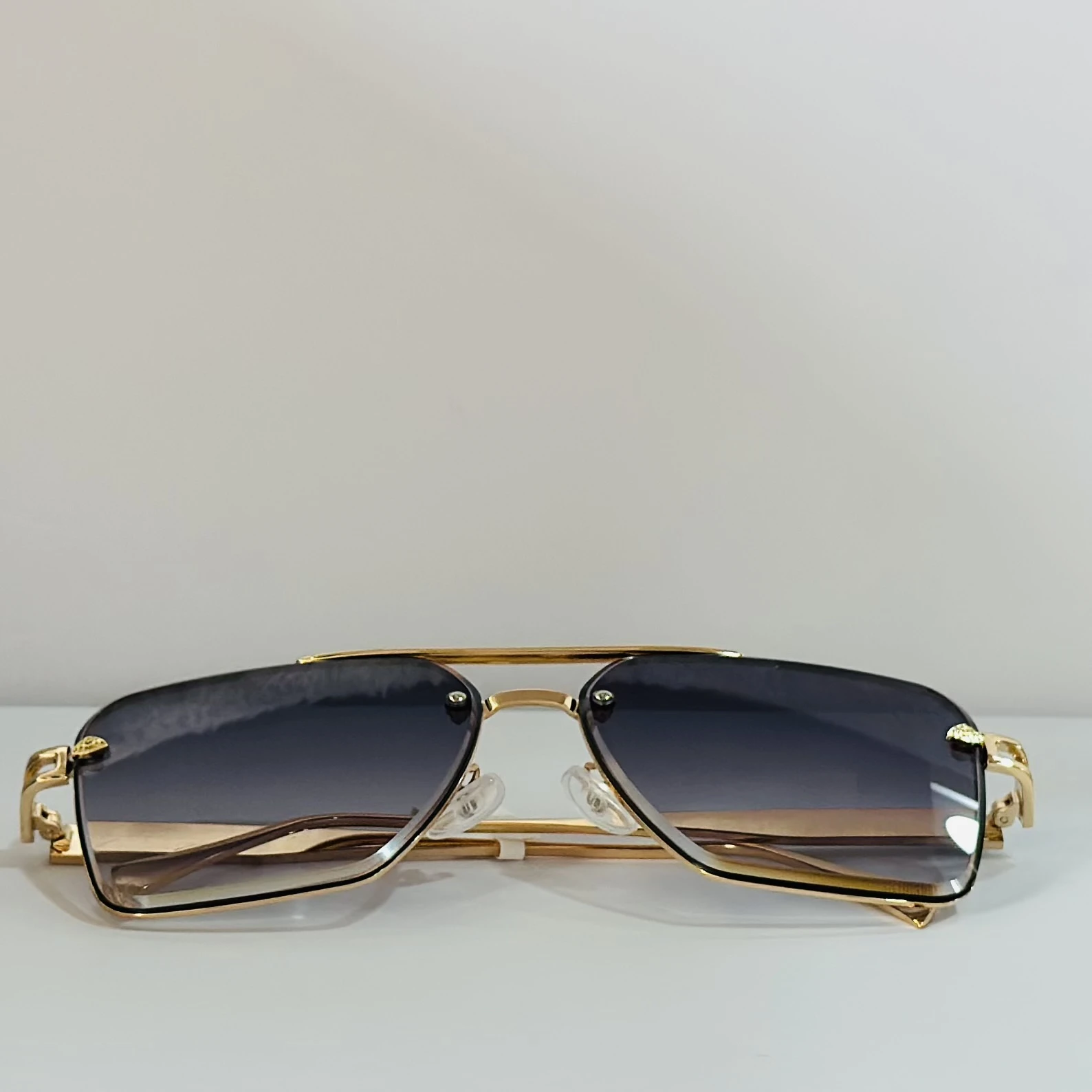 pair of gold-toned aviator-style sunglasses