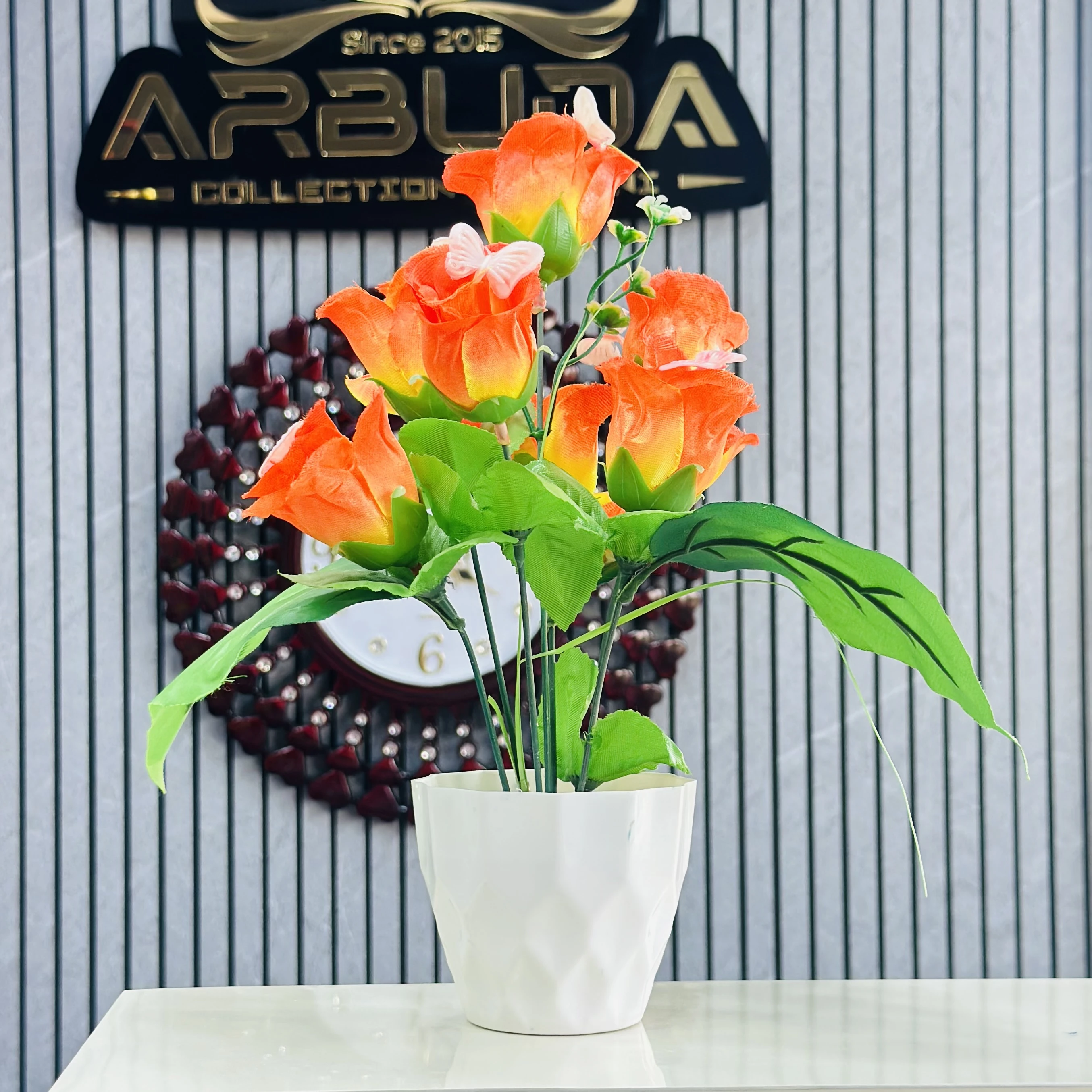 Apple Rose artificial flower bunch with a white pot.