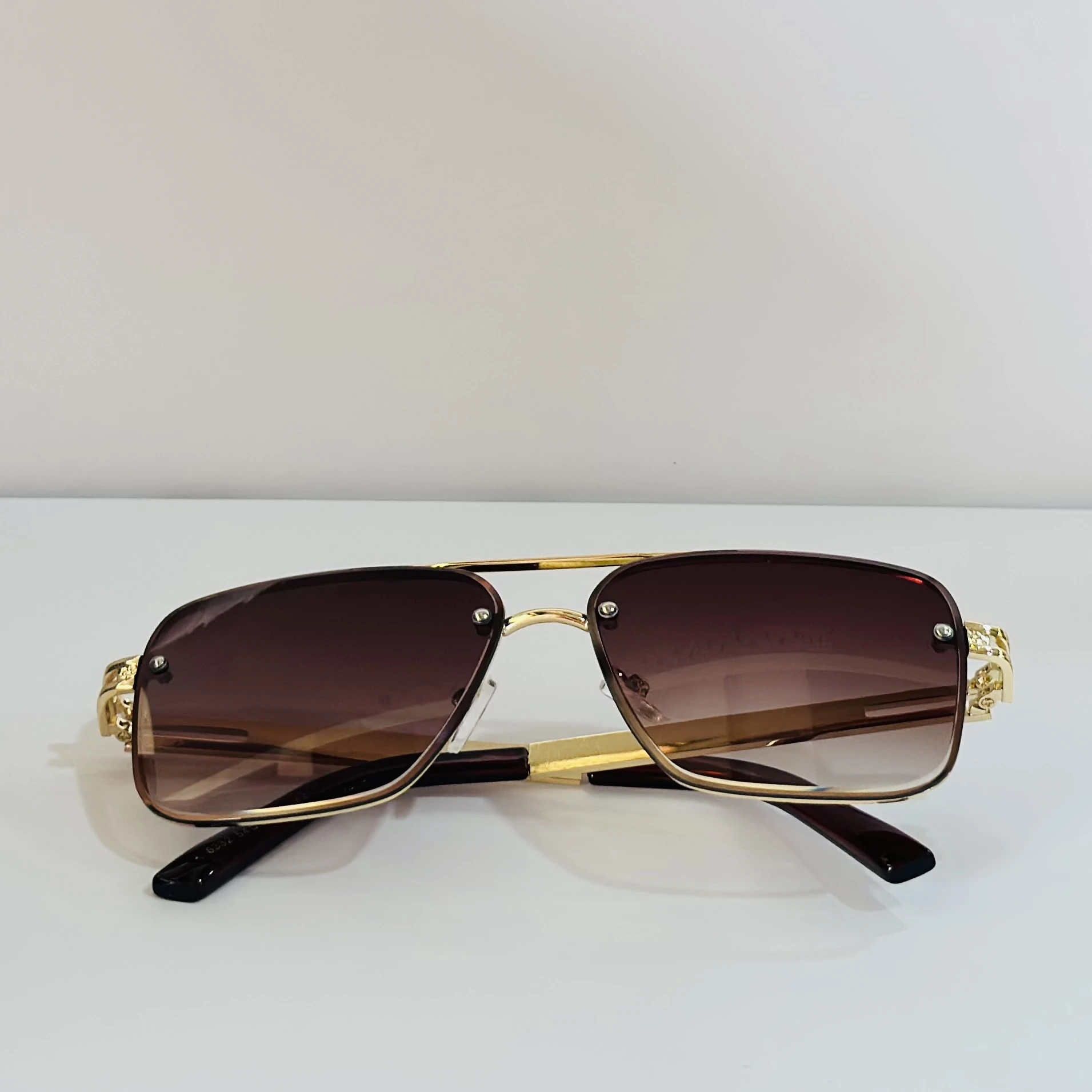 pair of Maybach aviator sunglasses with a gold-tone frame and brown gradient lenses