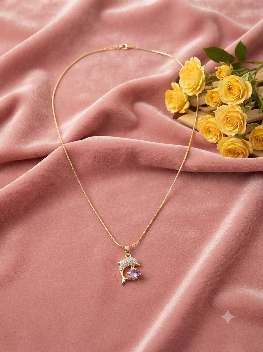 Gold plated necklace features a dolphin pendant