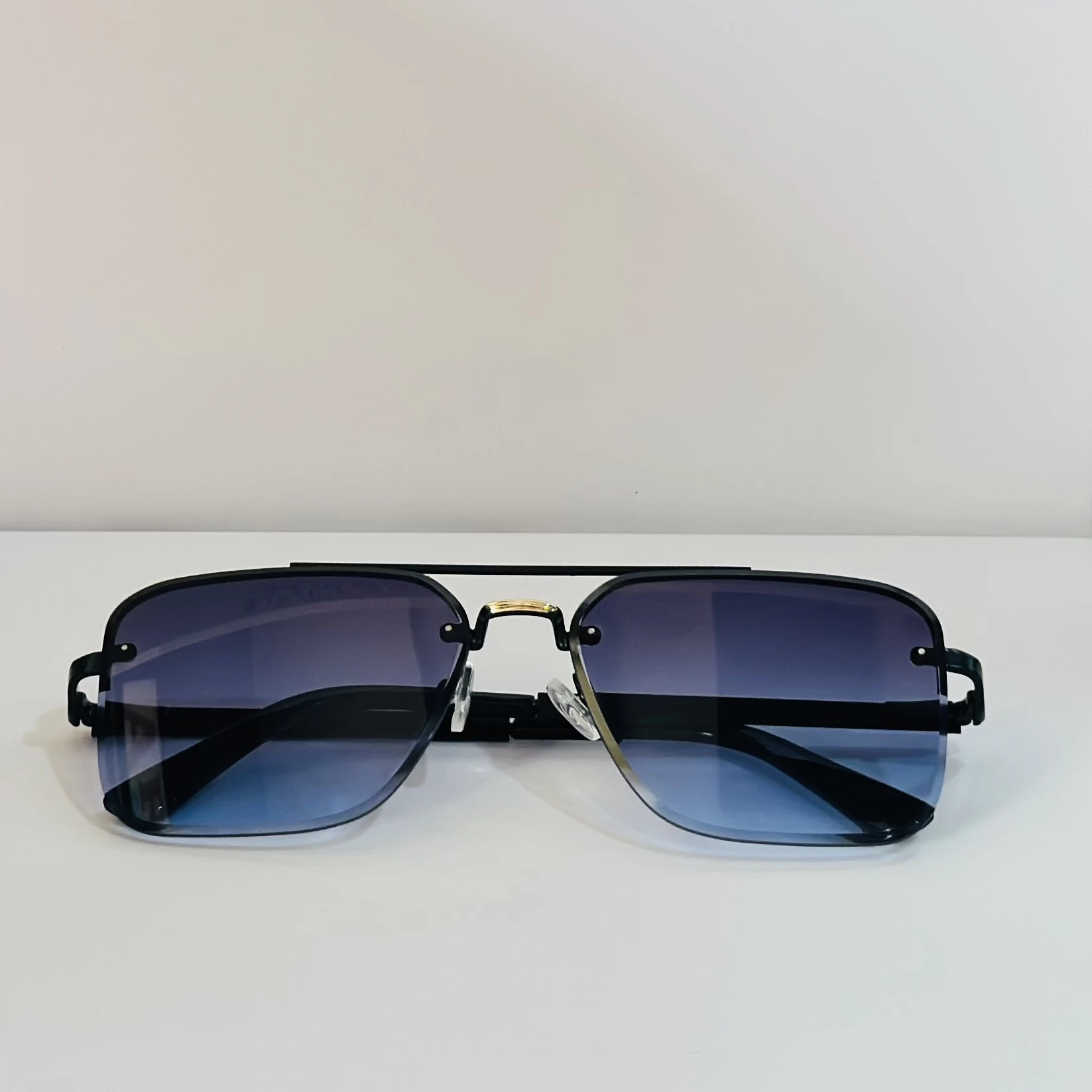 pair of Grey Jack Retro Square or Iron Man Square sunglasses with blue and grey lenses and a black frame.