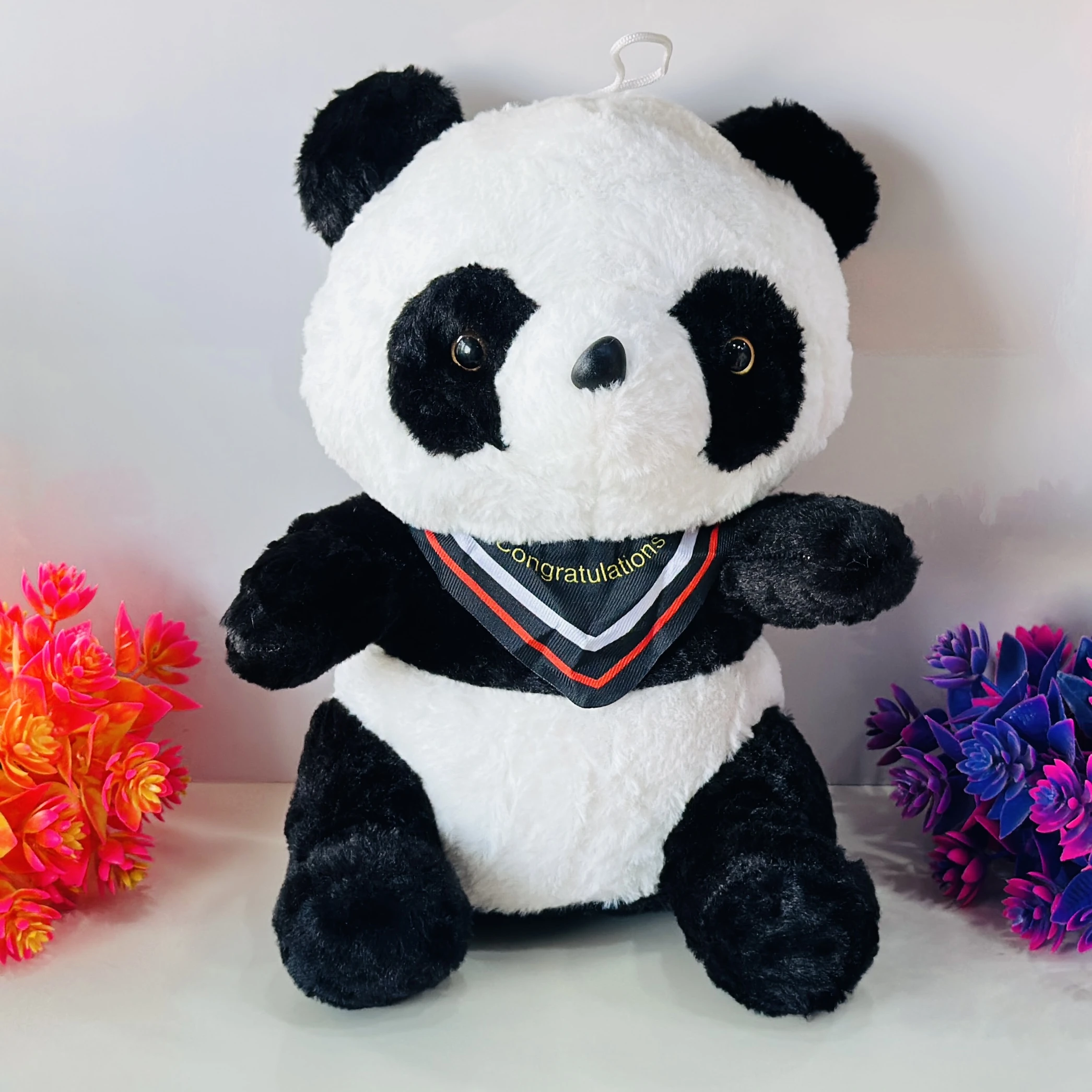 soft panda plush toy with a decorative "Congratulations" collar