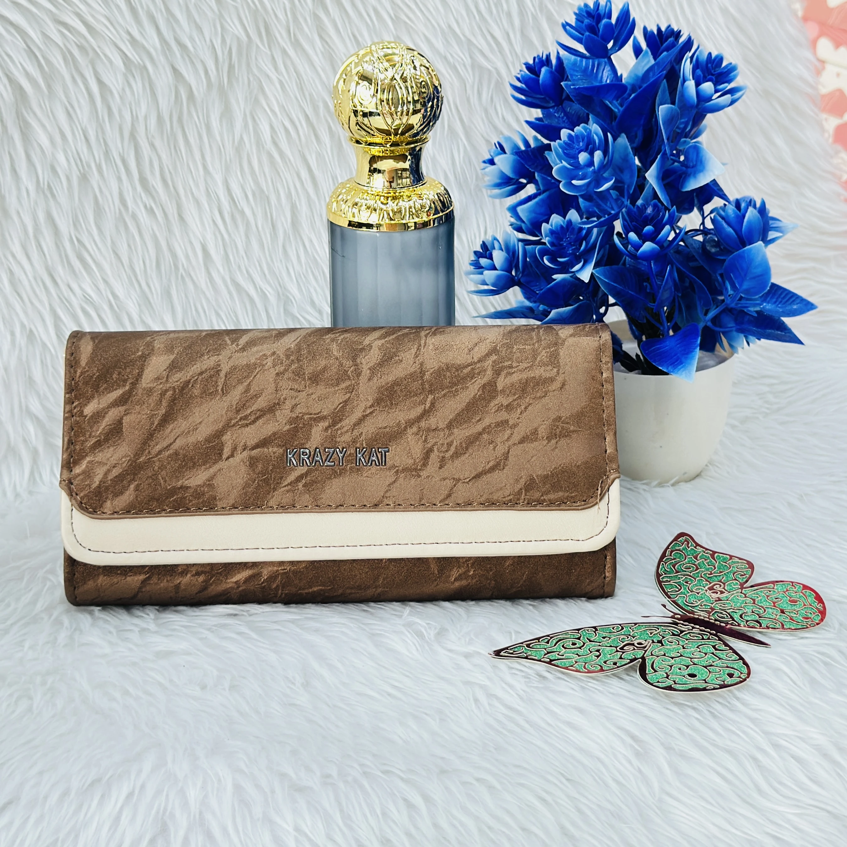 Brown and white clutch wallet