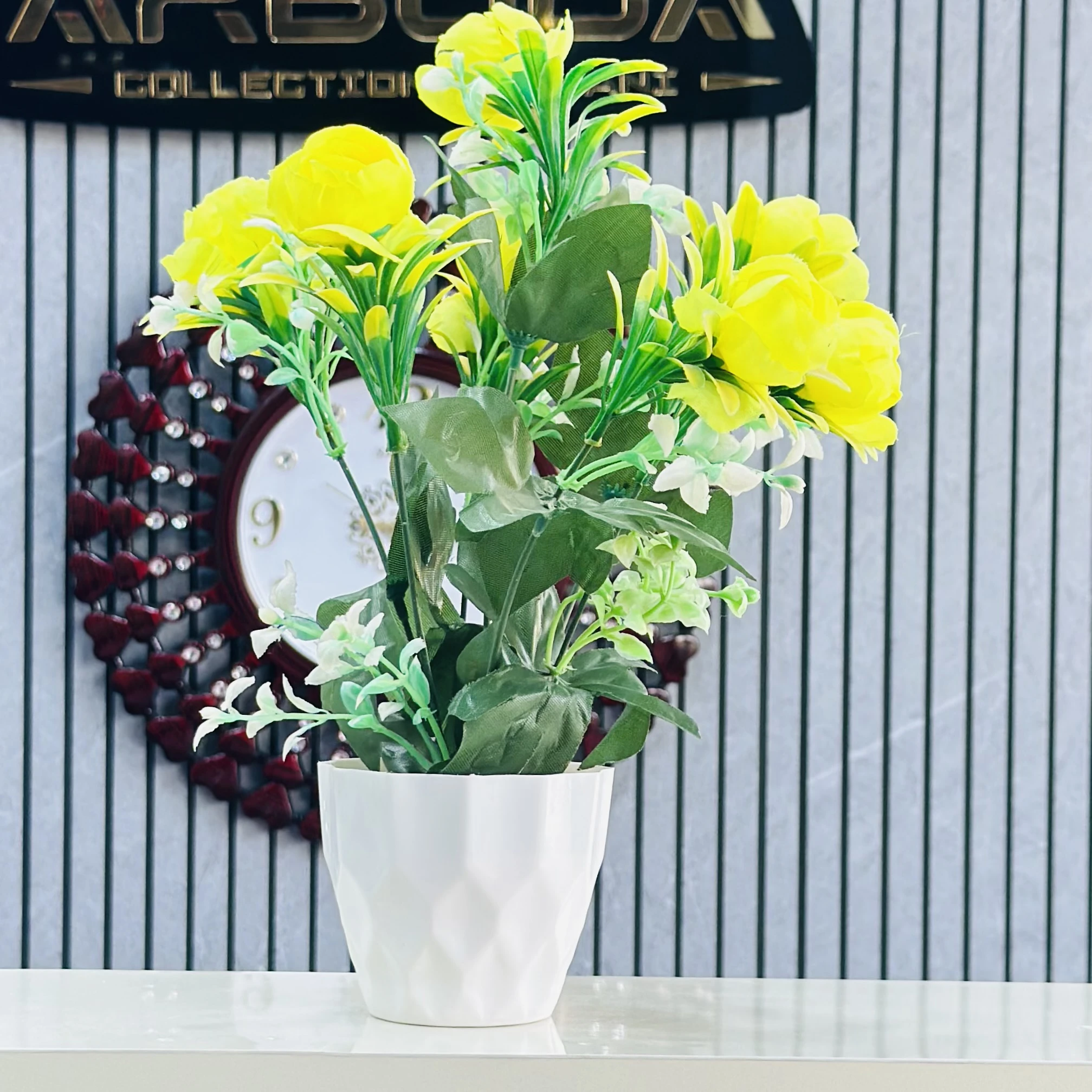 plant for decoration with yellow flowers and a white pot.