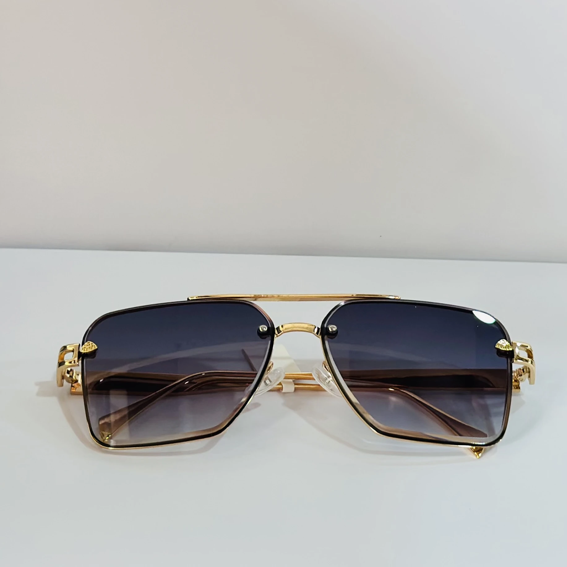 pair of gold-toned aviator-style sunglasses
