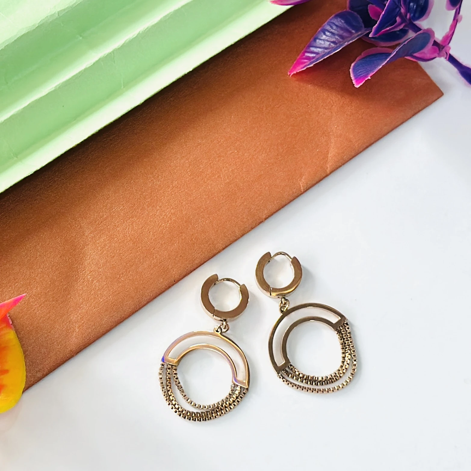 Gold plated chained circle drop earrings.