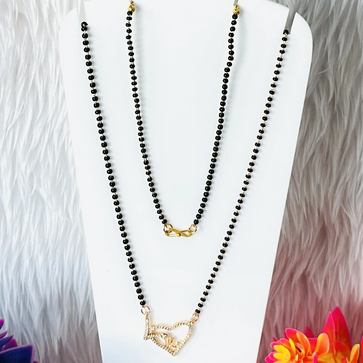 Gold plated American diamond-studded heart-shaped mangalsutra.