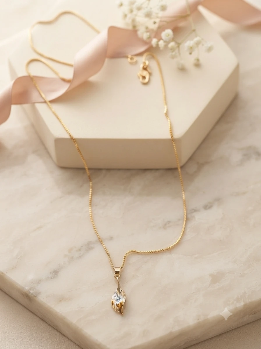 pendant features a pear-shaped