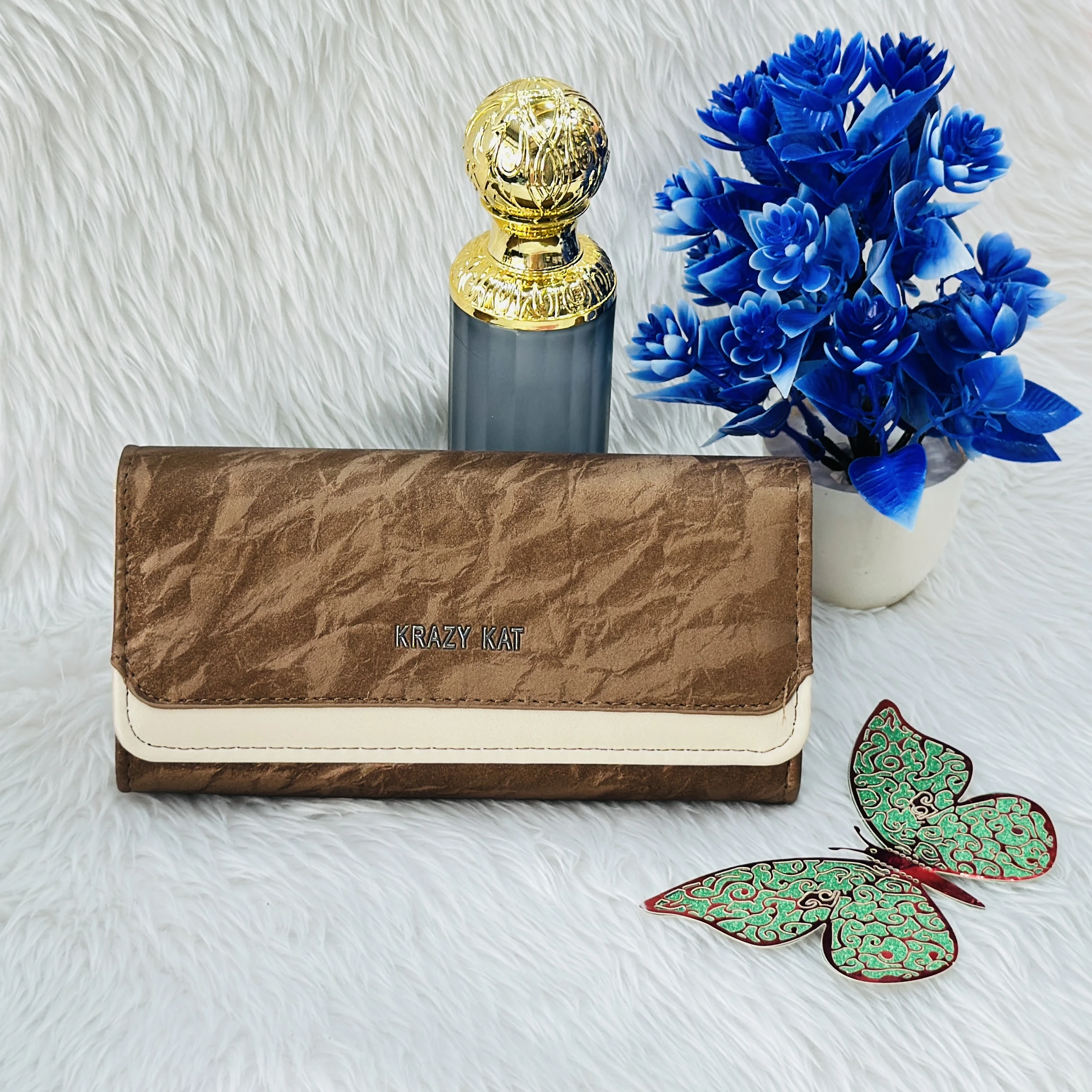 Brown and white clutch wallet