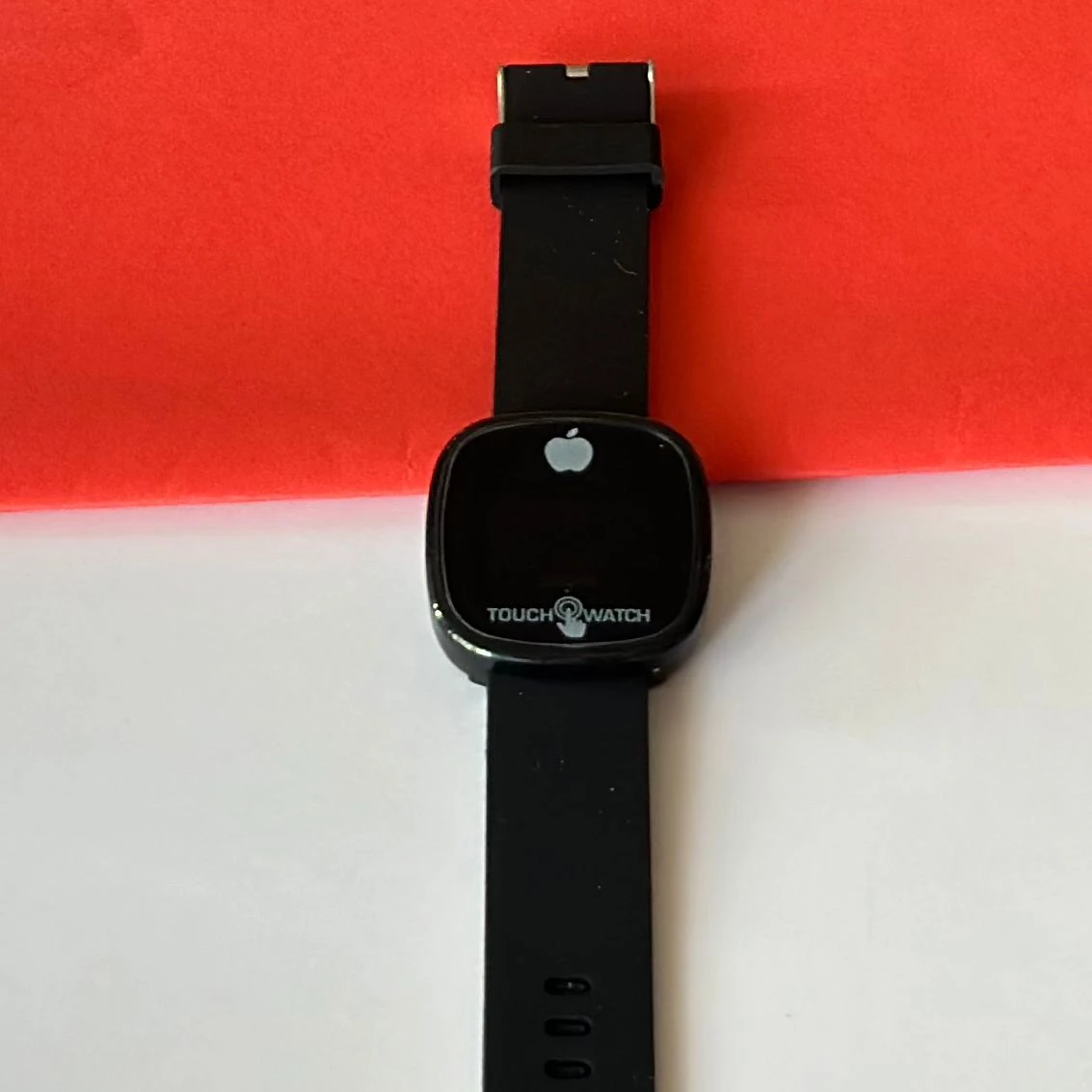 Black digital wristwatch with a blue silicone strap.