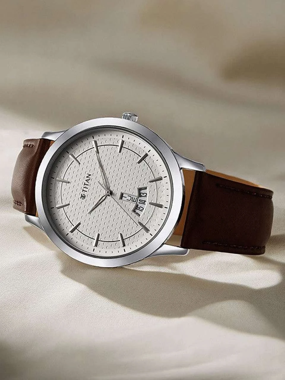 Titan On Trend analog watch featuring a clean white dial and a brown leather strap