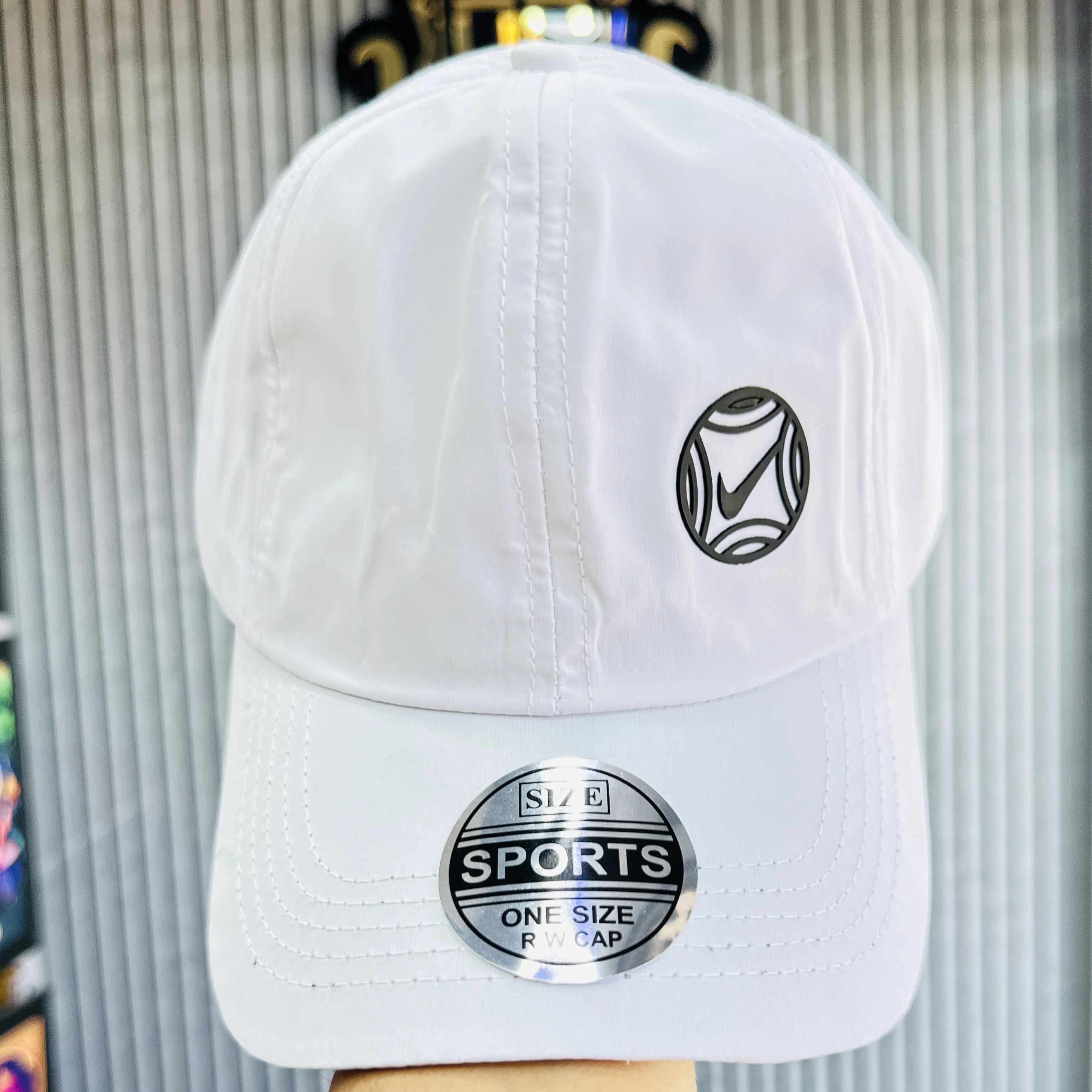 appears to be a white Nike branded baseball cap
