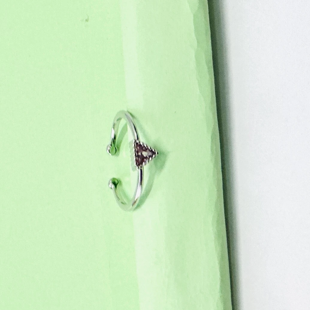 an emerald-cut imperial topaz or citrine solitaire ring in 14k gold.