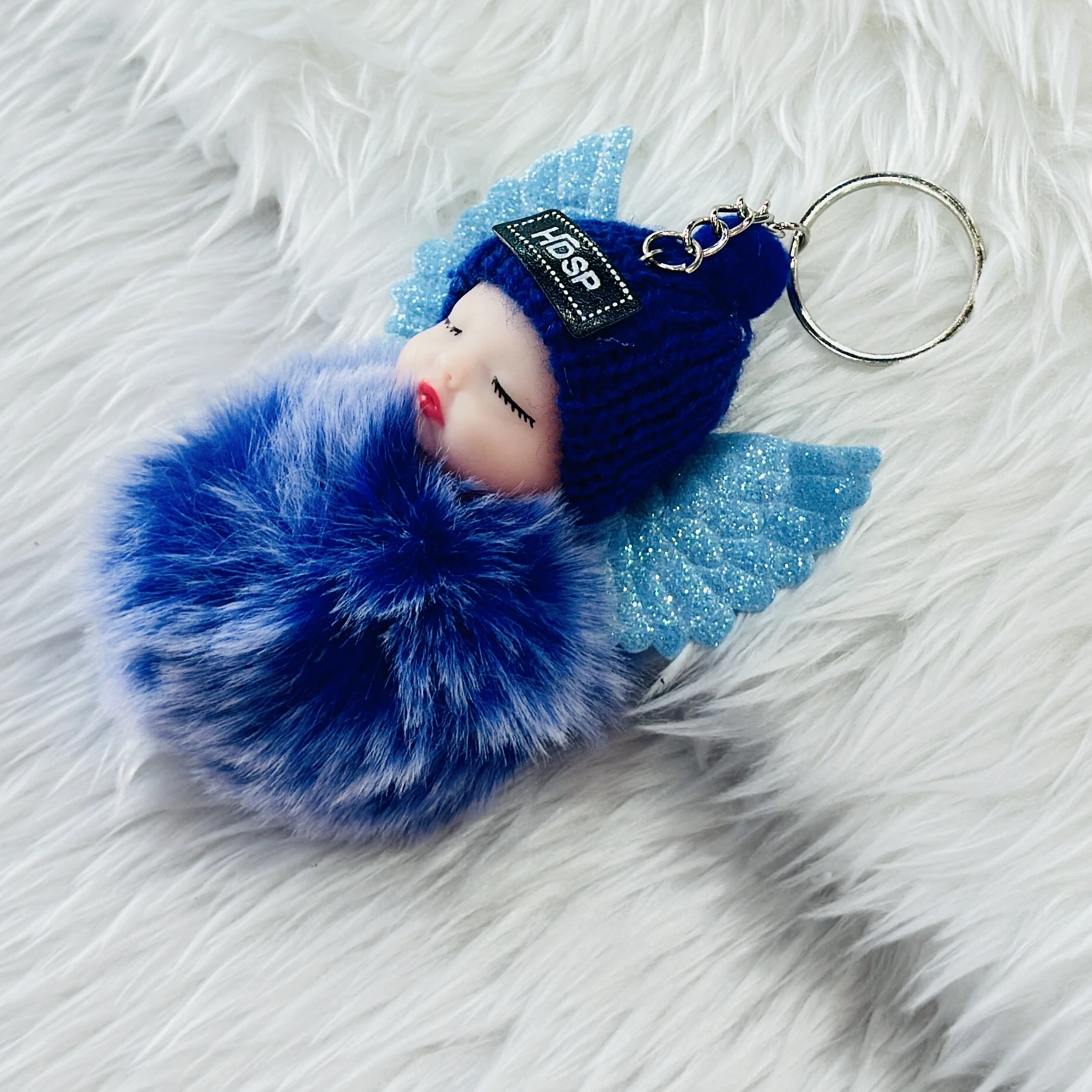 sleeping baby doll keychain