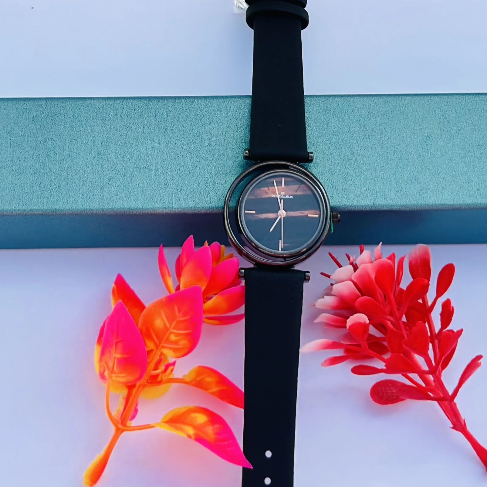 Analog Wrist Watch for Women, in the black variant with a brown/black dial.