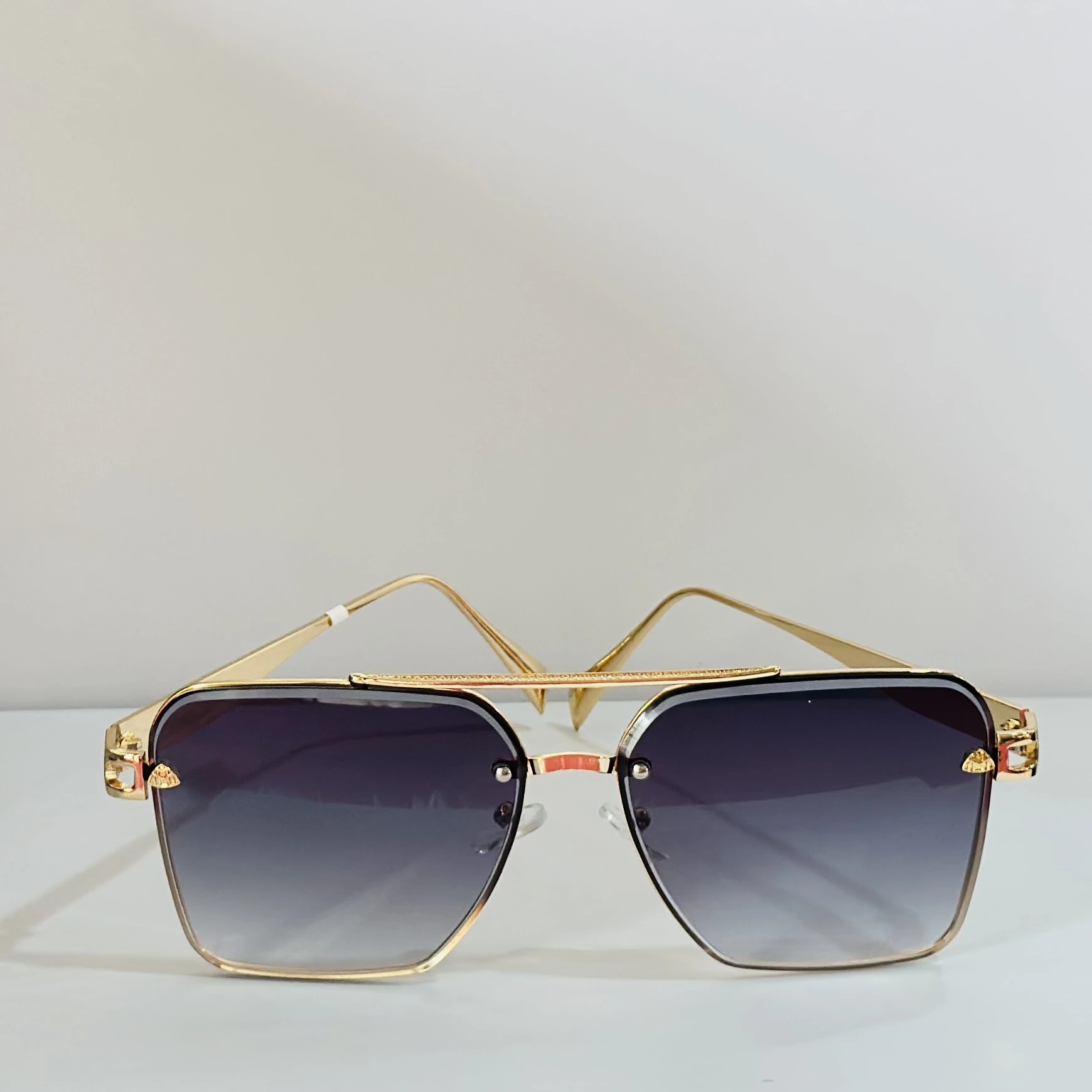 pair of gold-toned aviator-style sunglasses