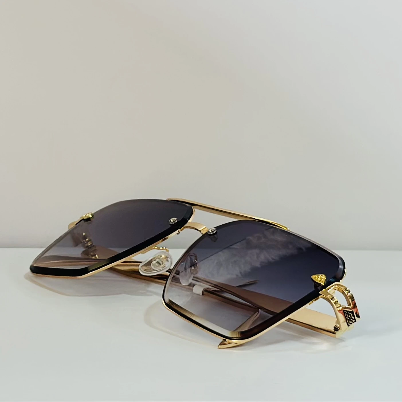 pair of gold-toned aviator-style sunglasses
