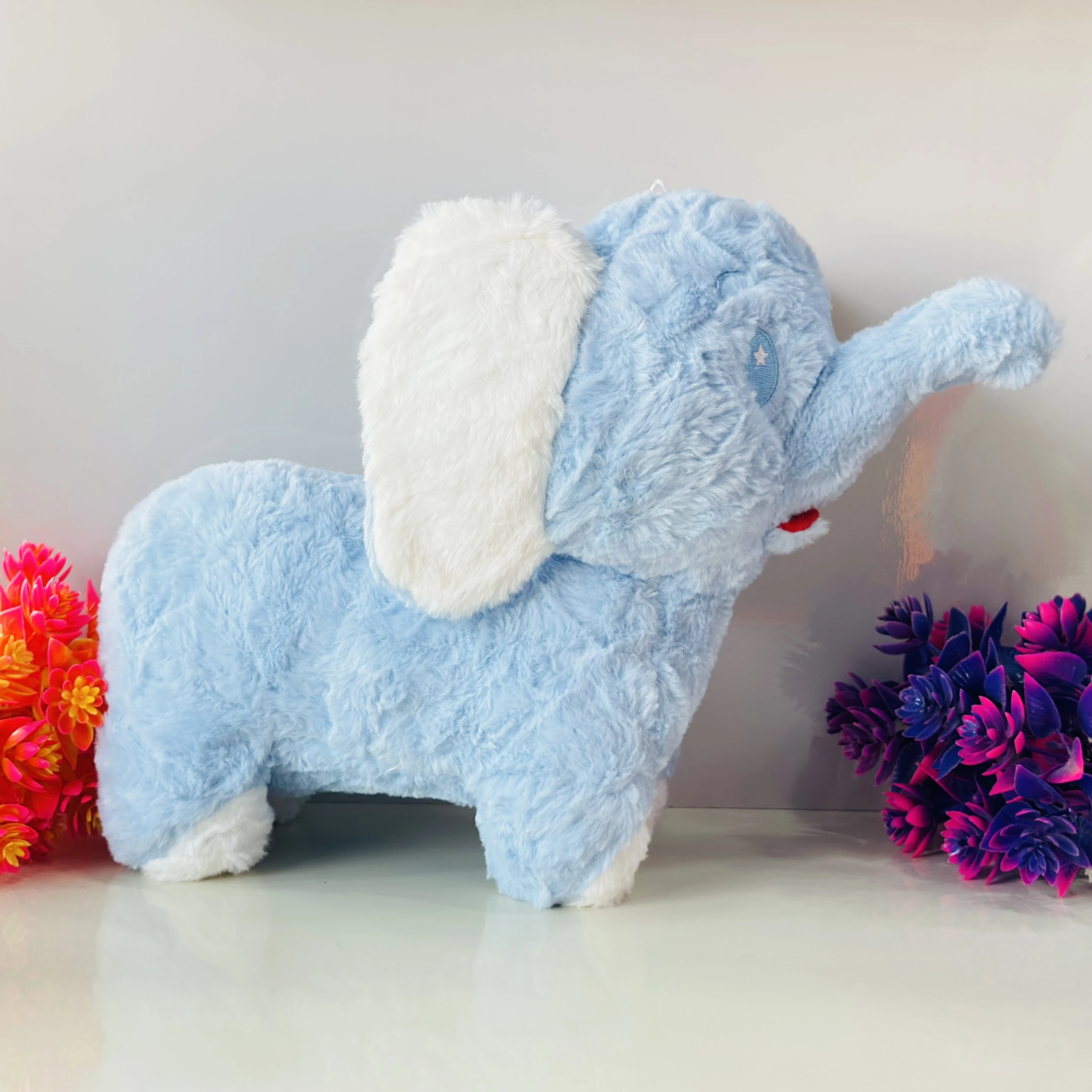 Soft blue elephant plush toy.