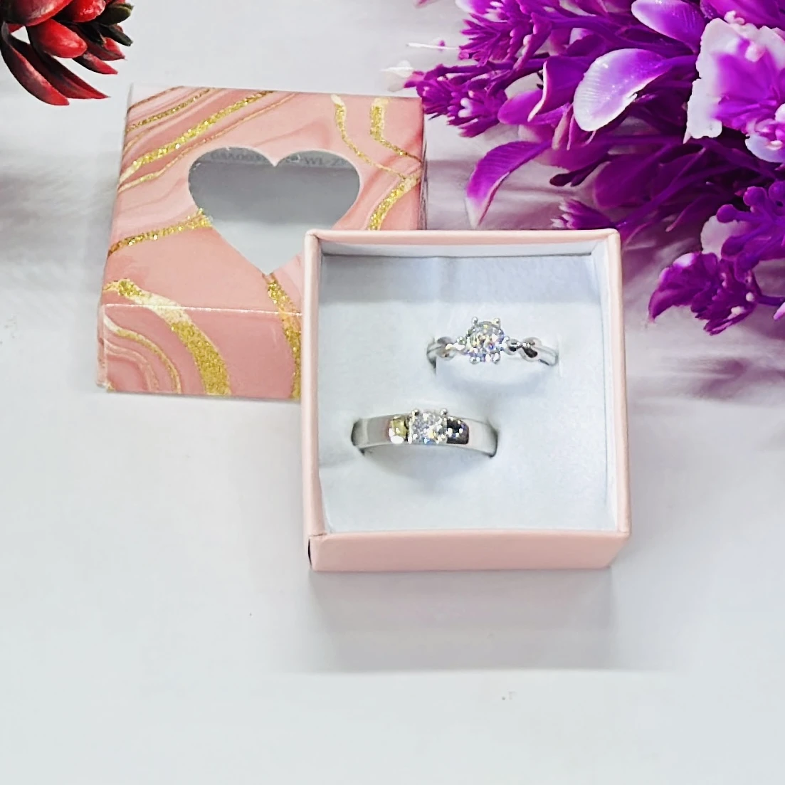 set of silver-plated, stone-studded, adjustable couple rings.