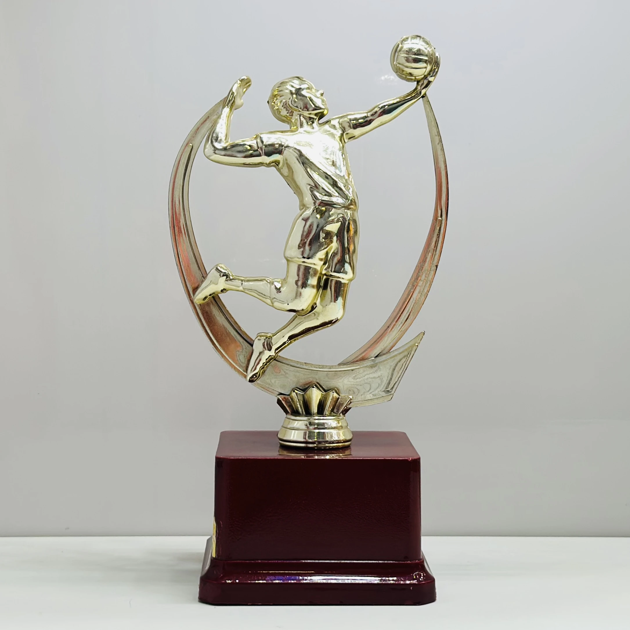 cricket trophy featuring a batsman figure.