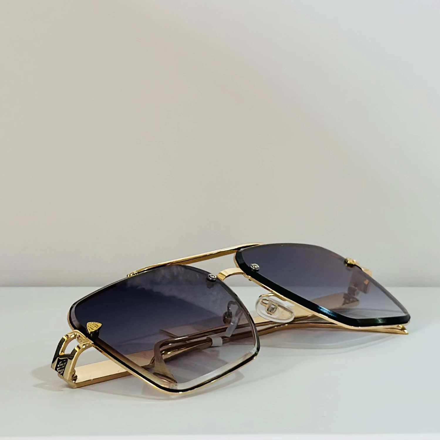 pair of gold-toned aviator-style sunglasses