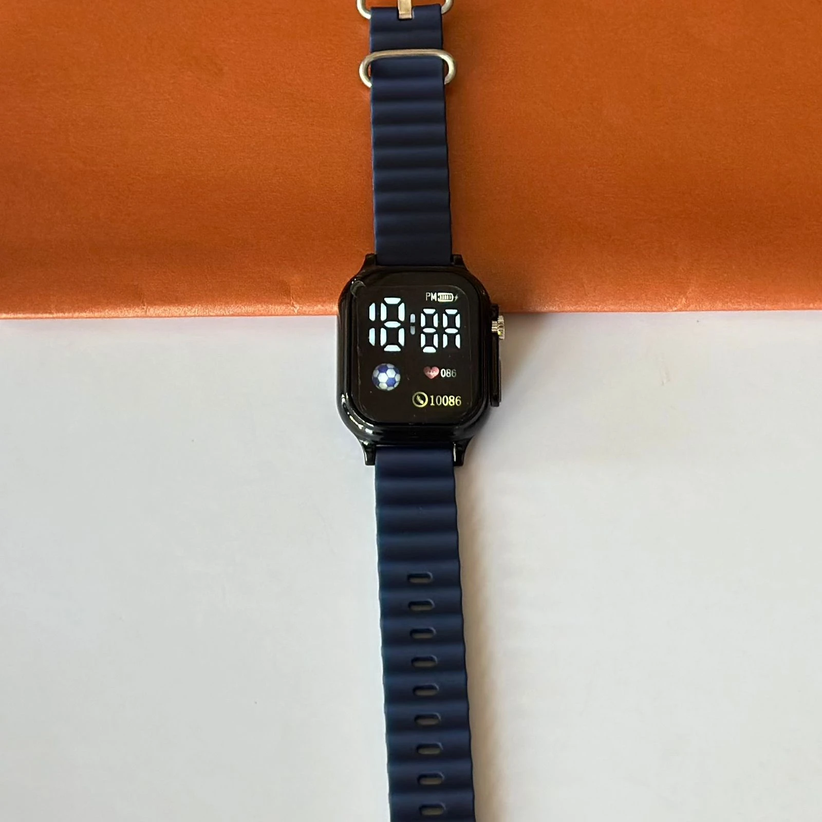 Blue digital watch with a silicone strap