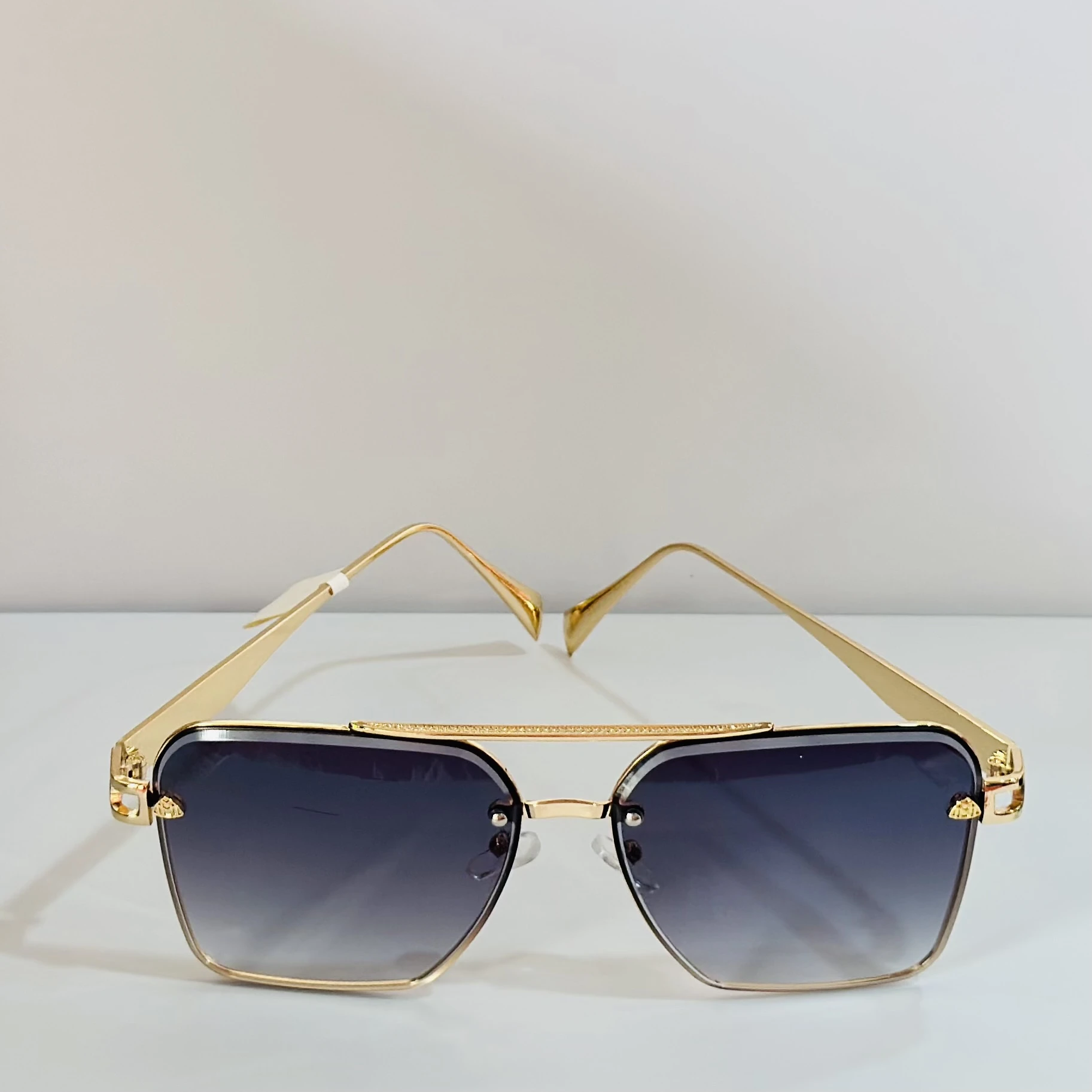 pair of gold-toned aviator-style sunglasses