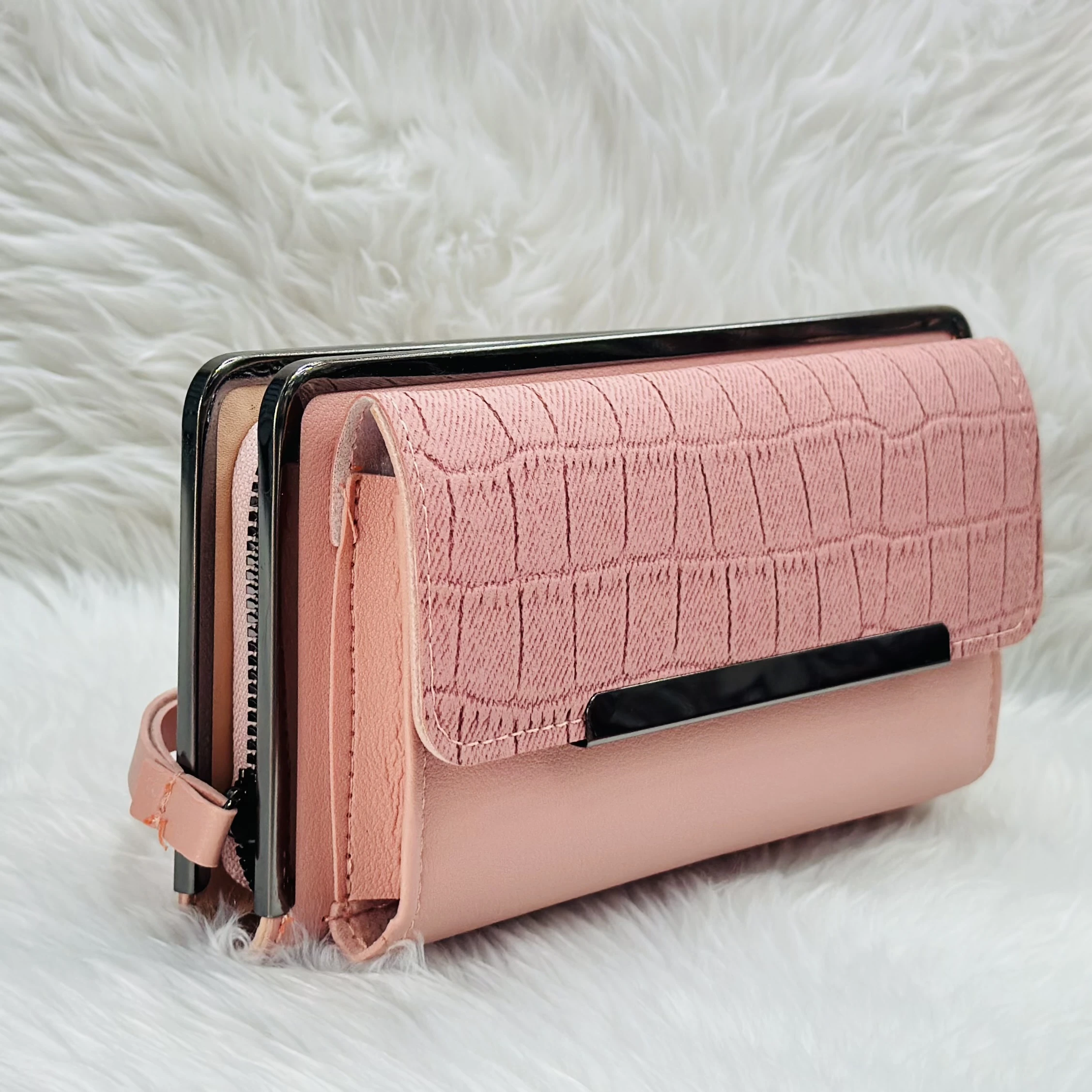 Brisfine pink clutch wallet in polyurethane outer material.