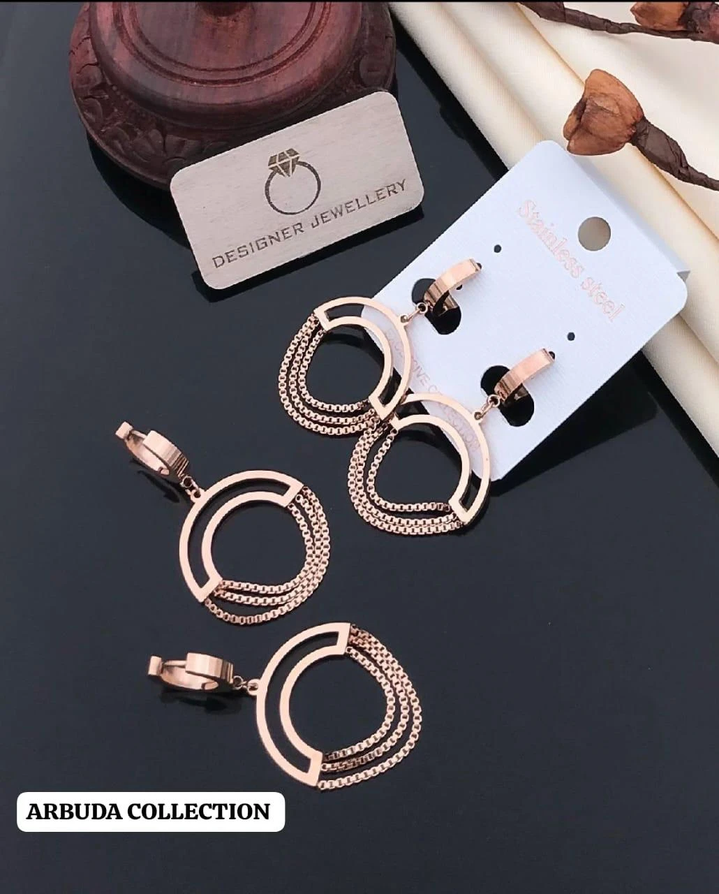 Gold plated chained circle drop earrings.