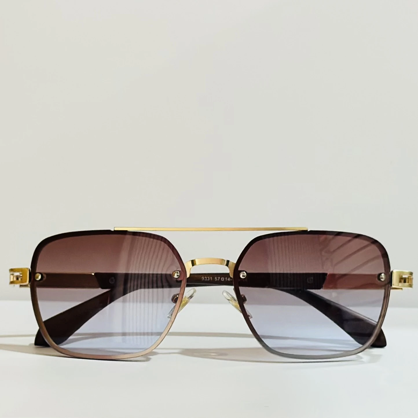 pair of Maybach square gradient sunglasses with a gold-tone frame.