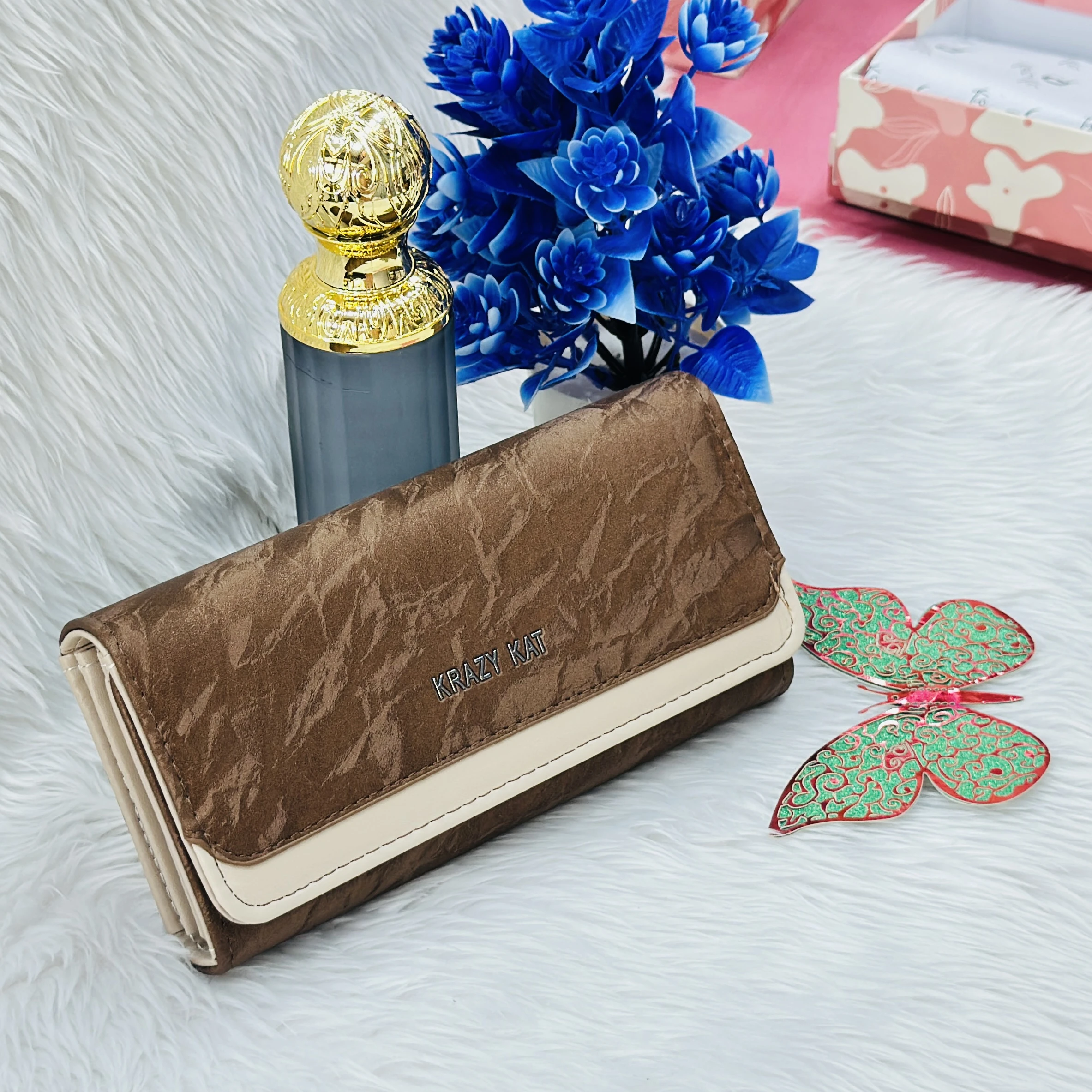 Brown and white clutch wallet