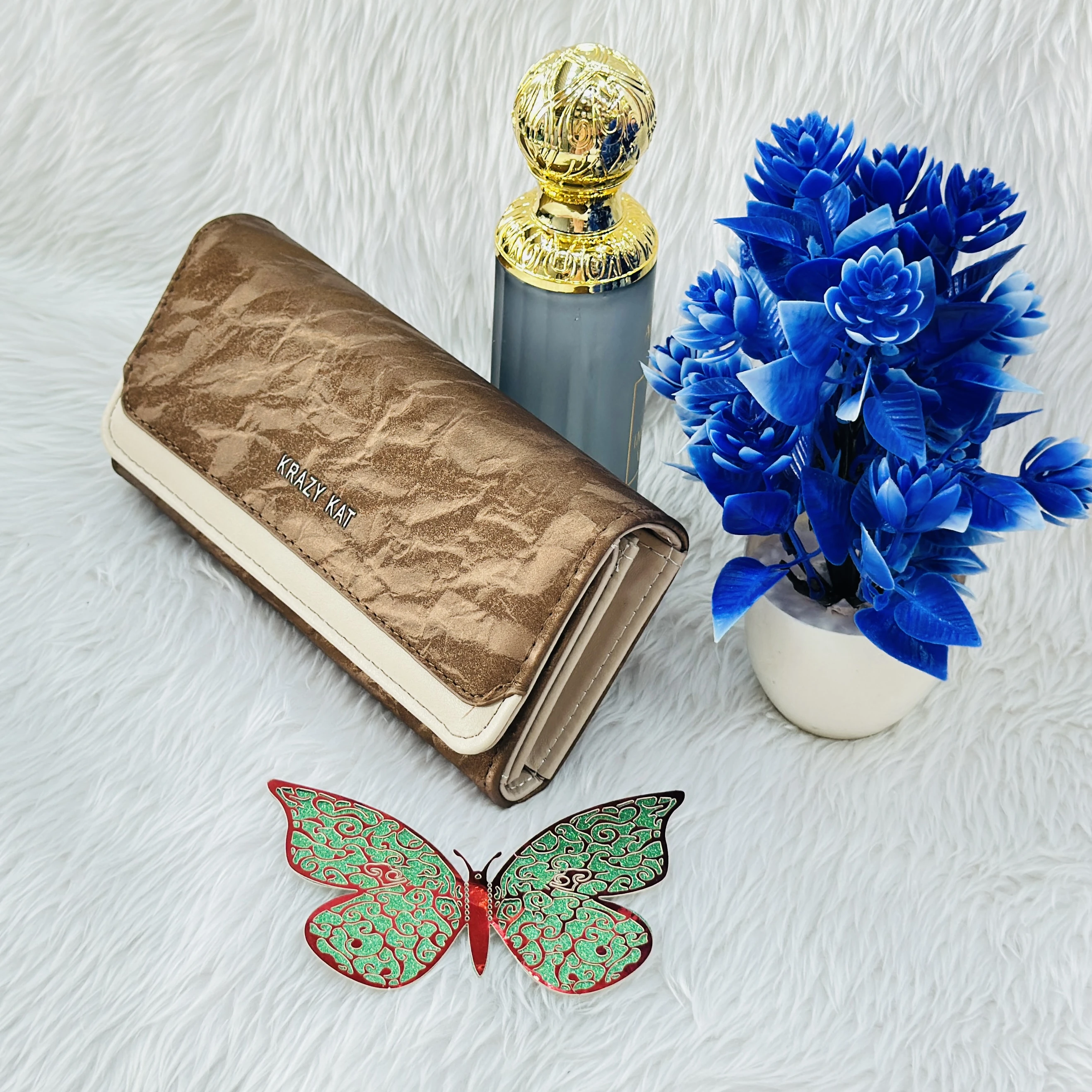Brown and white clutch wallet