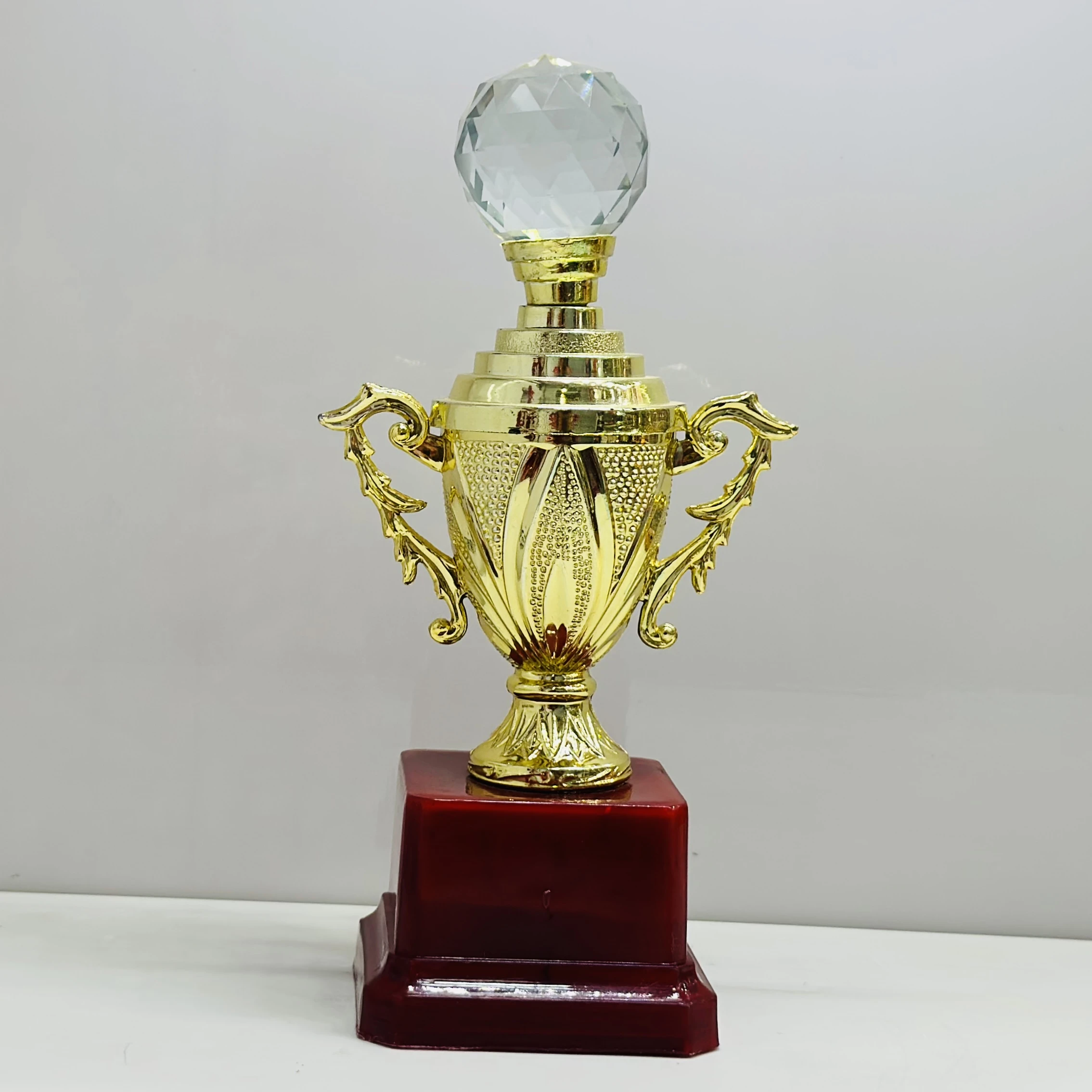 cricket trophy featuring a batsman figure.