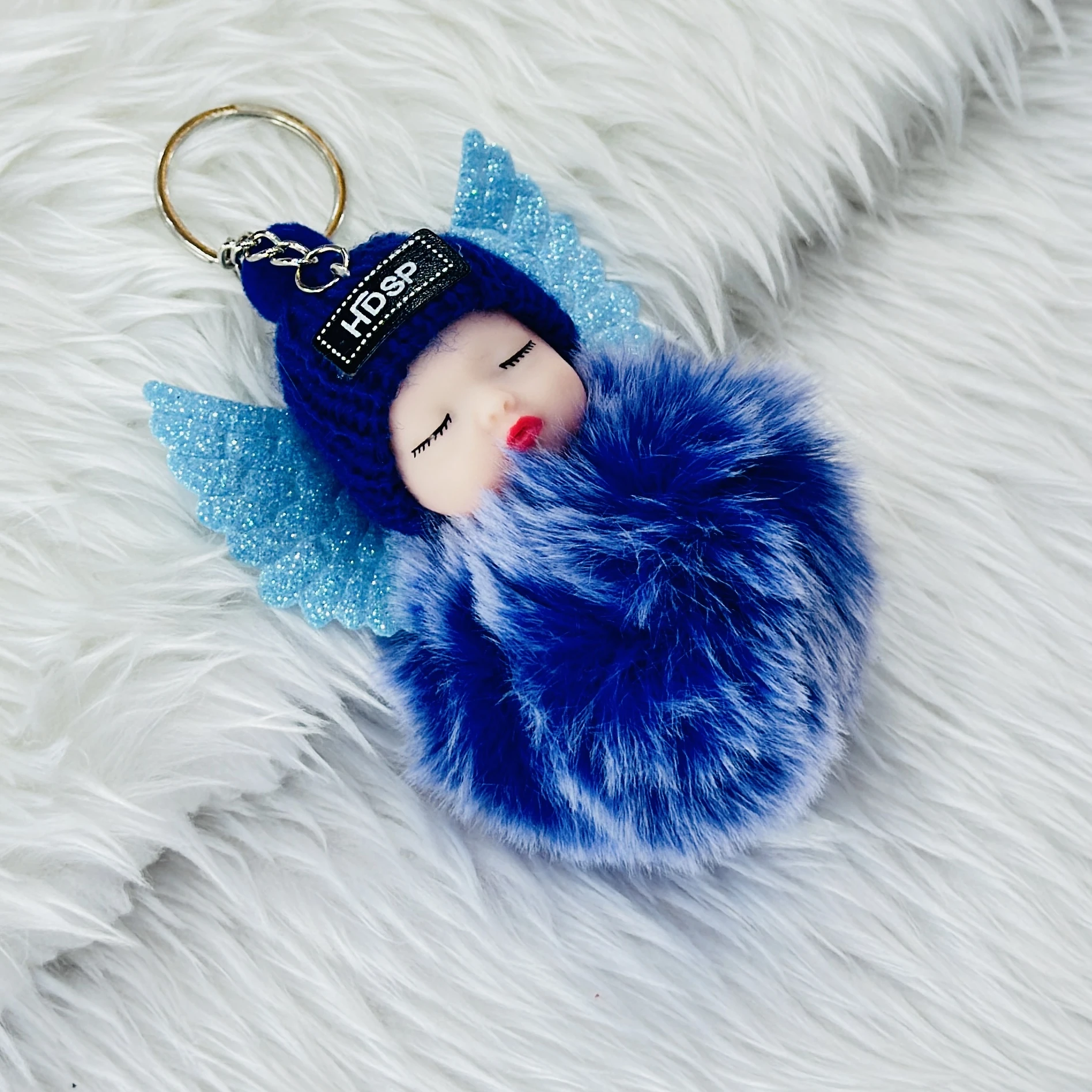 sleeping baby doll keychain