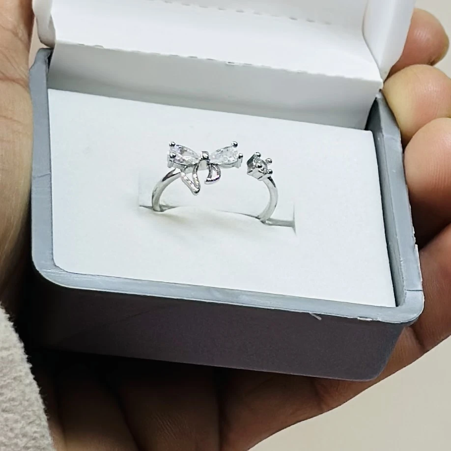 sterling silver floral ring with zircon stones.