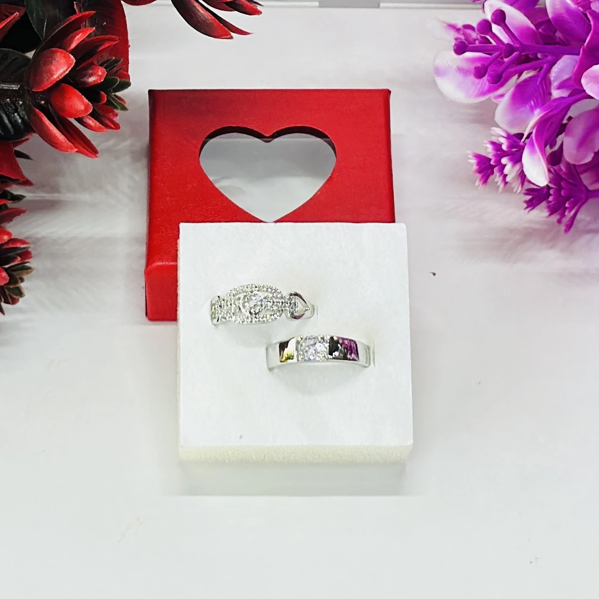 Set of silver-toned couple rings