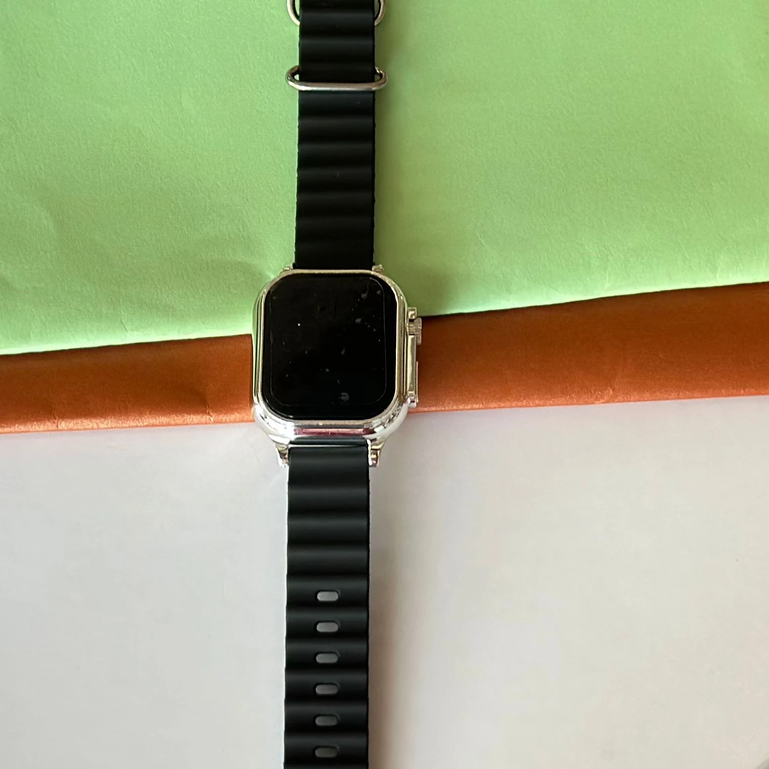 Black digital watch with a silicone strap