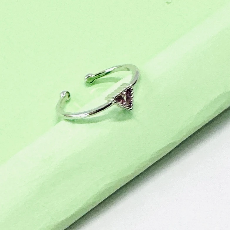 an emerald-cut imperial topaz or citrine solitaire ring in 14k gold.