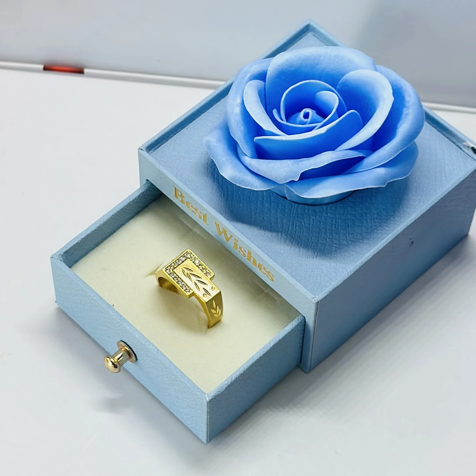 1 gram gold-plated men's ring with a rectangular face and side stone accents