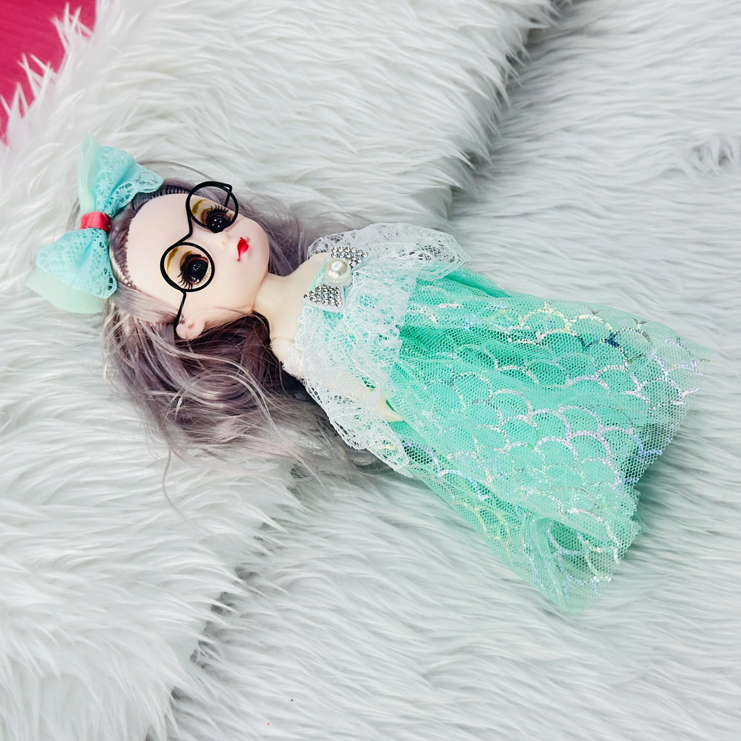 Doll  keychain featuring a fashionable